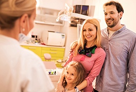 Mother father and child in dental office