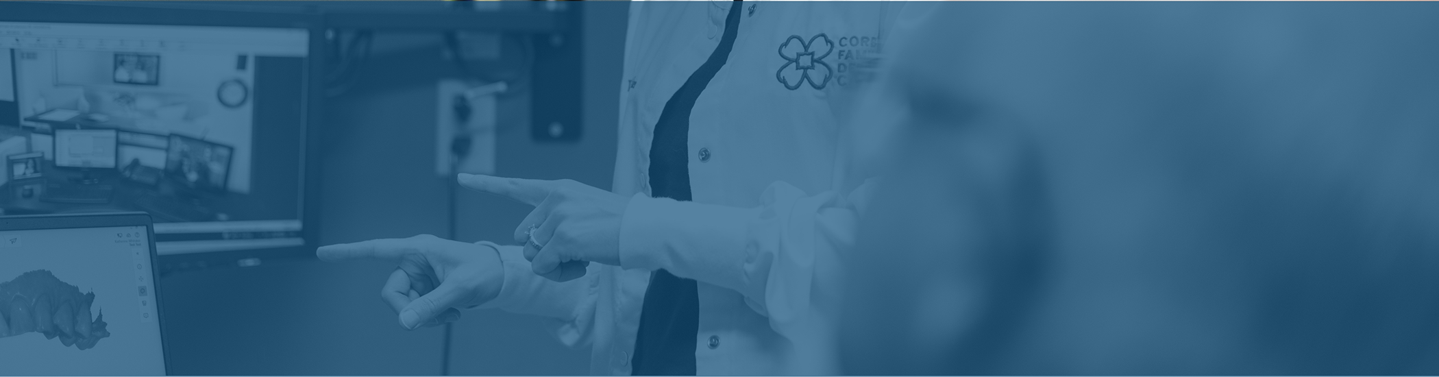 Doctor Whitaker showing a patient a digital scan of their teeth