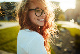 a woman enjoying the benefits of dental implants in Corbin