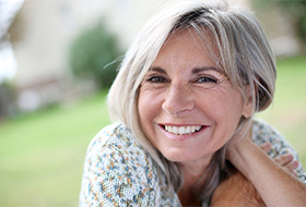 a woman enjoying the benefits of dental implants in Corbin