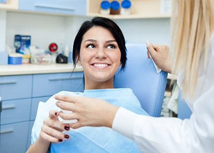 Smiling woman in dental chair