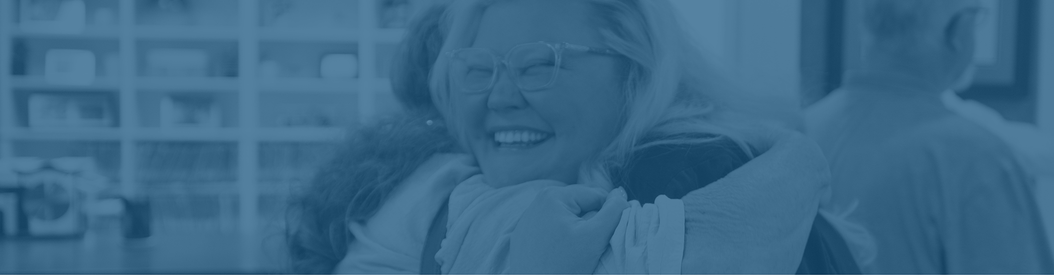 Two women embracing in a Corbin dental office