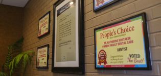Framed accolades for Corbin Family Dental Care and Doctor Whitaker on the wall