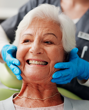 Senior woman grinning in the dental chair