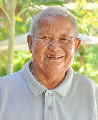 Smiling senior man missing a few teeth