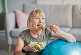 Woman eating salad