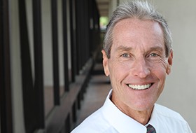 Man smiling outside