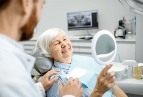 Older woman at dentist for dentures