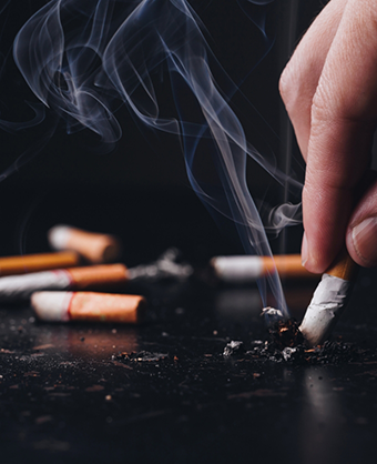 Person putting out their cigarette