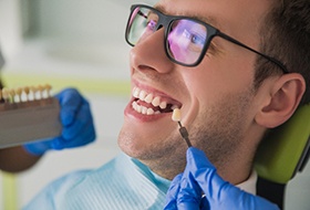 Smiling young man getting dental implants in Corbin