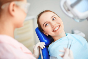 Smiling woman in dental chair