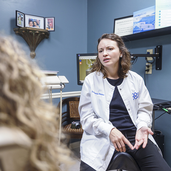 Sedation dentist talking to a patient