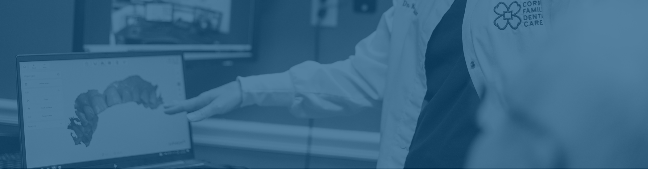 Doctor Whitaker showing a patient a digital impression of their teeth