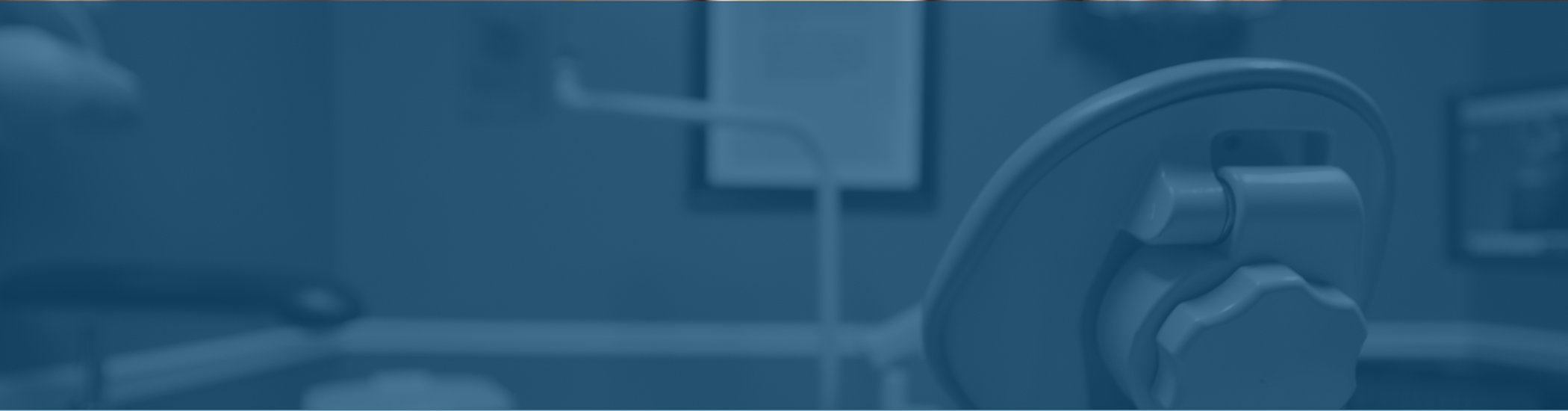 Empty treatment chair in a dental office in Corbin