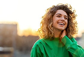 smiling person walking through the city