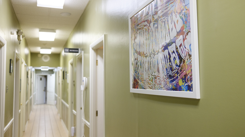 Wall art of teeth in the hallway