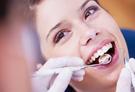 Woman receiving dental exam