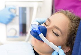 Woman with nitrous oxide nasal mask