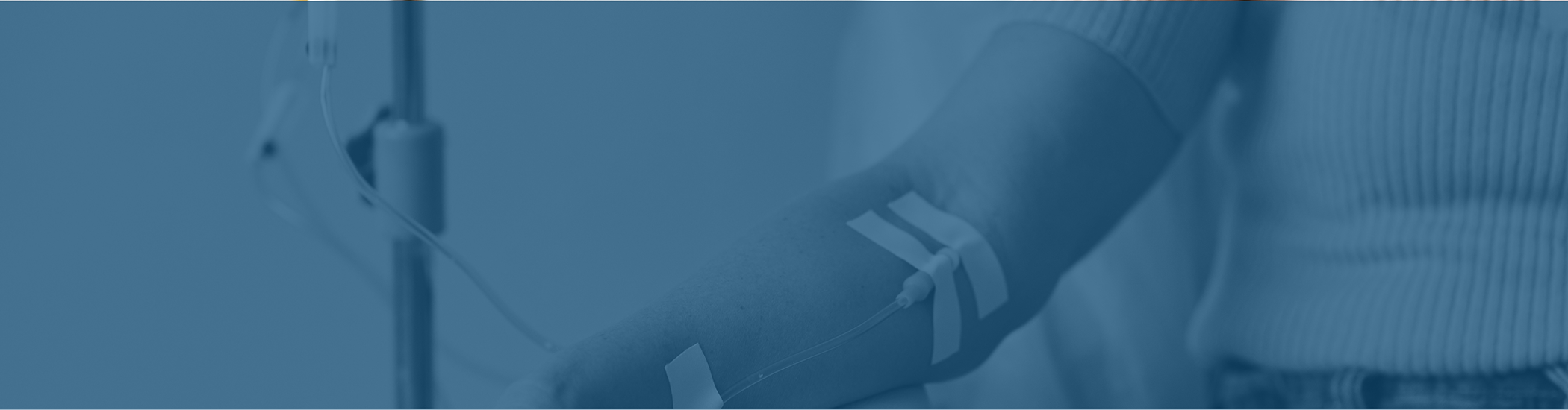 Patient hooked up to an IV while visiting their sedation dentist near London