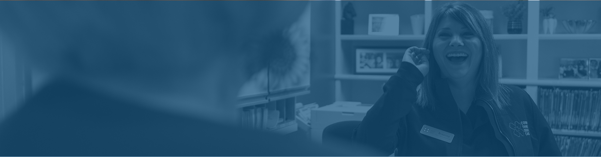 Dental team member smiling at a patient