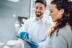 happy patient talking to dentist 