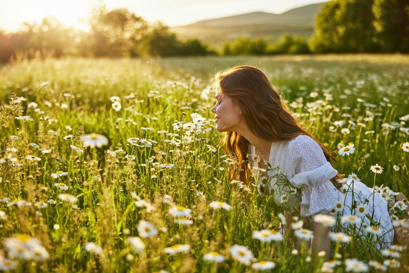 Woman in field of flowers